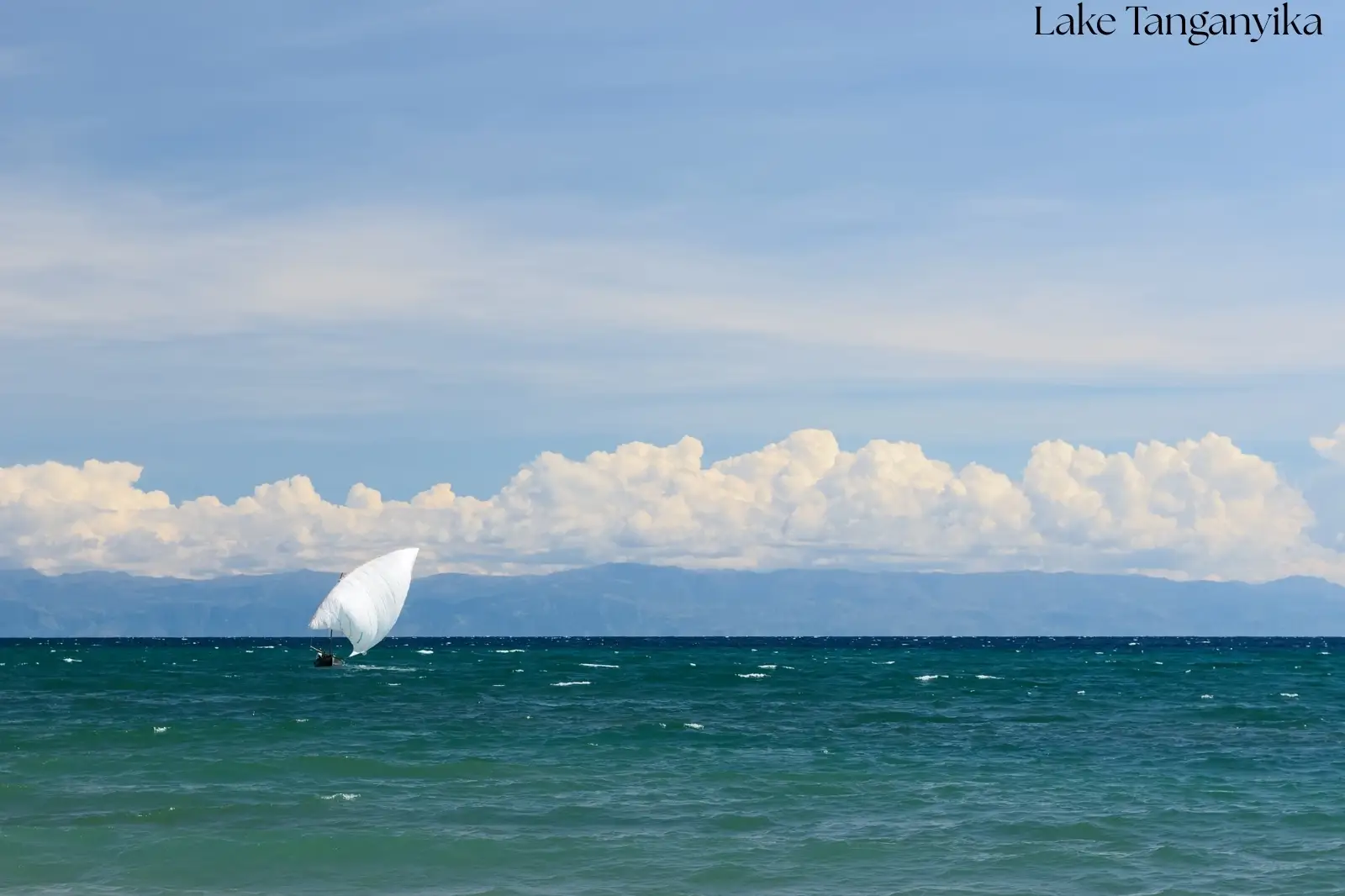 Traditional fishing boats sailing on the crystal-clear waters of Lake Tanganyika