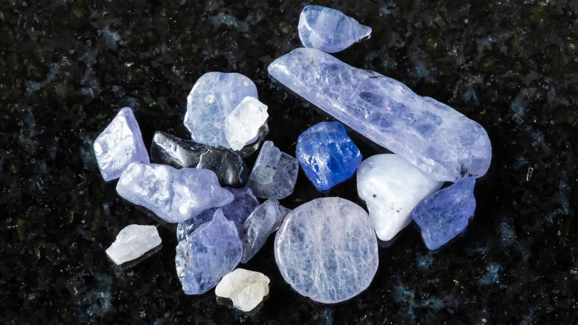 Raw tanzanite crystals showing natural striations and color variations from the Merelani mining area - Porcupine Tours
